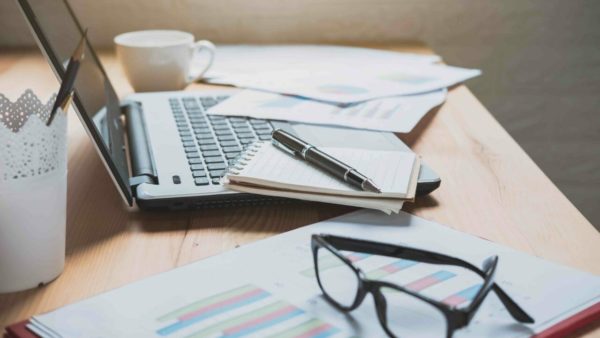 Desk office with marketing graph statistics analysis